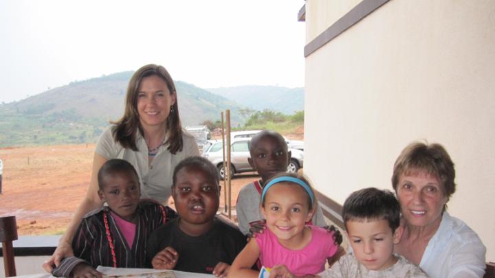 Betancourt with her children, Anna and Joey; her mother, Norma; and their friends Didier, Yvonne, and Pabelo at the Inshuti Mu Buzima/Partners In Health District Hospital in Rwanda