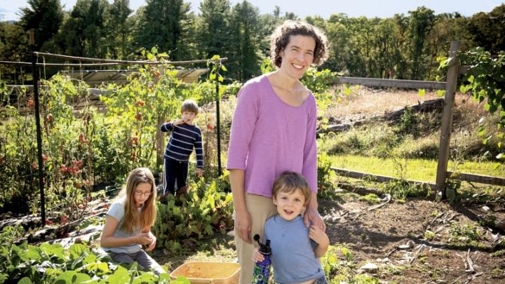 Zoe Resch with her children (clockwise from left) Prairie (9), Silas (7), and Calder (3) in their family vegetable garden in Vermont 