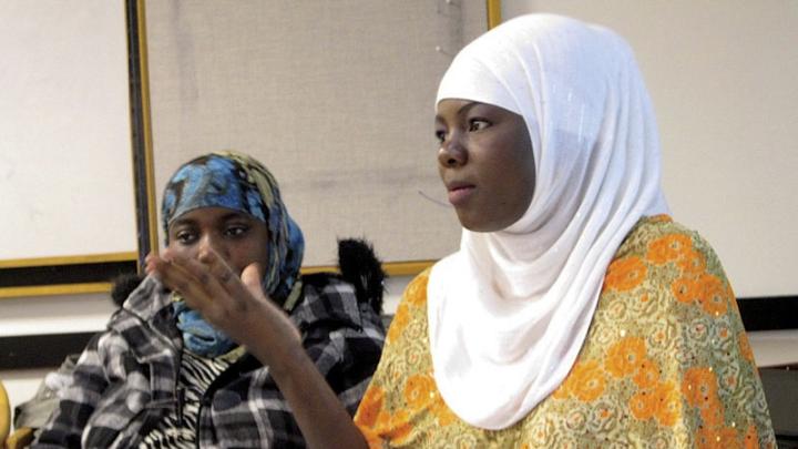 Zahara Haji (foreground) and Amina Abdullahi, research assistants in Betancourt’s project with the Somali Bantu refugee community in Boston, during a presentation at Chelsea City Hall  