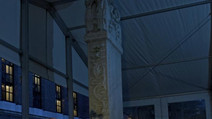 The Peabody Museum's Alexandre A. Tokovinine, a lecturer on anthropology and research associate, is shown at work within a protective tent during the scanning of the Chinese stele—conducted at night for optimal results. 