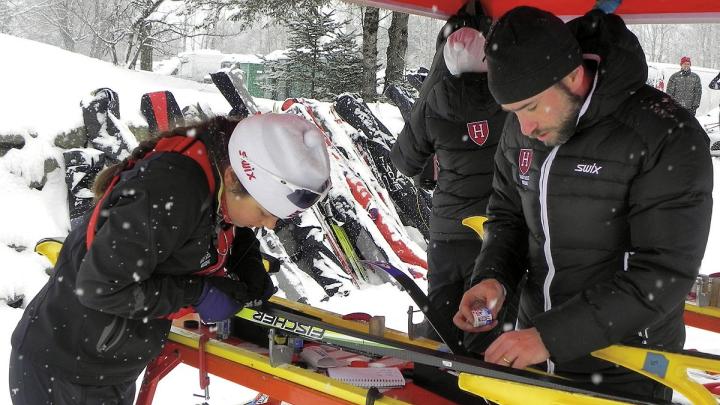 Harvard&rsquo;s Nordic ski team head coach Chris City tests waxes with racer Alena Tofte &rsquo;13 before the Dartmouth Carnival in Craftsbury, Vermont, last winter. 