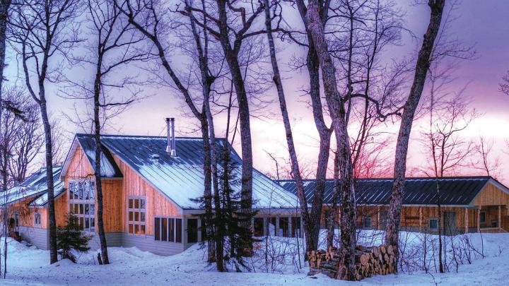 Maine Huts &amp; Trails offers winter sunsets in the wilderness (along with food, hot showers, and convivial company) at the Stratton Brook Hut. 