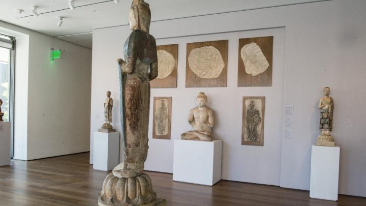 Natural daylight accentuates the materials of the sculptures—marble, sandstone, lingering traces of colored pigments and gold decorations—in one of the museums’ galleries of Buddhist art.