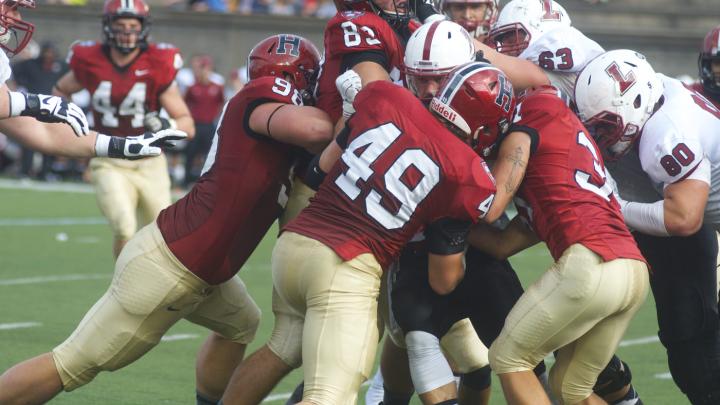 Linebacker Eric Medes ’16 (number 49), with nine tackles, and defensive lineman Dan Moody ’16 (number 98), whose two tackles included a sack, led a host of Harvardians who continually surrounded Lafayette ballcarriers and did not let the Leopards offense get on the board until the fourth quarter.