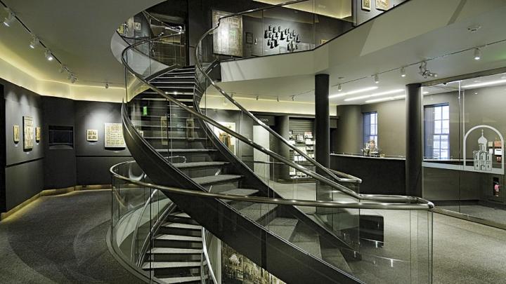 An elegant interior spiral staircase leads to exhibits.