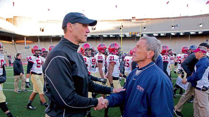 Coach speak: At Franklin Field last year, Murphy chatted with Al Bagnoli, the only Ivy coach to have a winning record against the Crimson under Murphy.