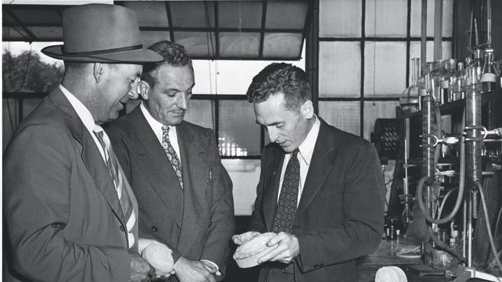 Walker, with visitors, in his lab in 1948