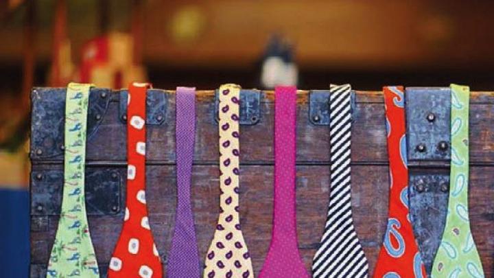 A display rack holding colorful men’s bow ties