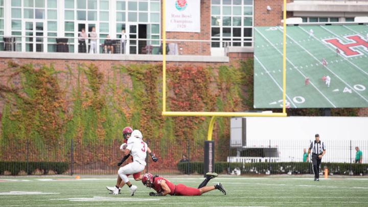 Two Harvard defenders pursue a Lafayette wide receiver.