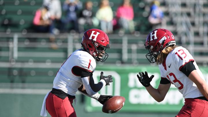 Harvard receivers Kym Wimberly and Ledger Hatch hold a choreographed end-zone celebration after Wimberly's second-quarter run for a score. 