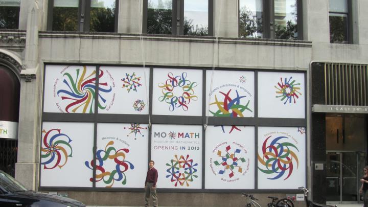 Whitney stands outside the MoMath building.