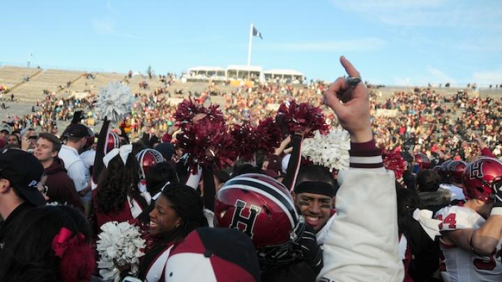 Harvard partisans stormed the field at Yale Bowl to celebrate the Crimson’s seventh consecutive victory over the Blue. Thousands of discouraged Yale followers had left the Bowl at halftime.