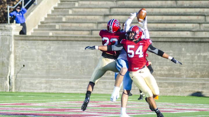 On a late Columbia offensive foray, Lions receiver Ben Kaplan found himself in the middle of hard-hitting double coverage by Crimson defensive back Asante Gibson ’16 (number 22) and linebacker Eric Ryan ’17. Ryan also had a fumble return and led the Crimson with 10 tackles. 