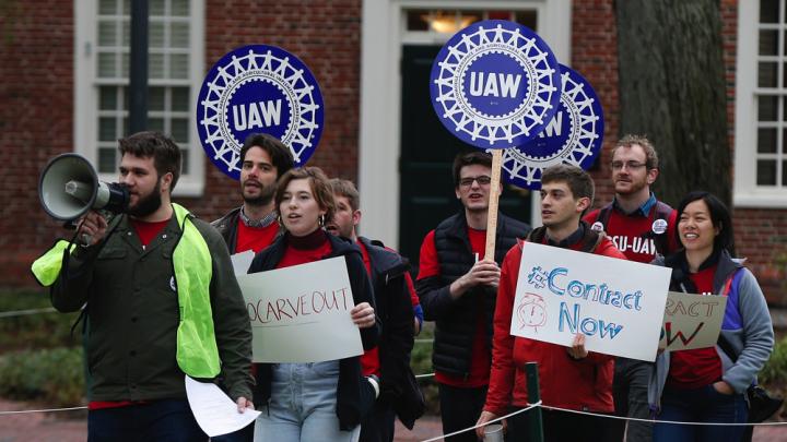 Union protesters march at Harvard University in Cambridge, Mass., Wednesday, May 1, 2019.