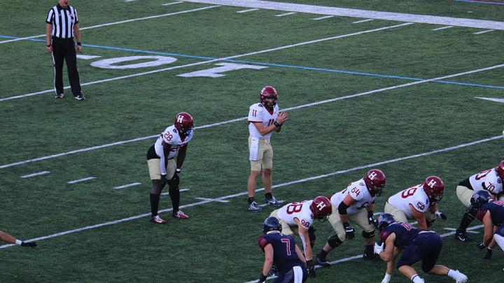 Harvard quarterback Charlie Dean surveying the Penn defense, on his way to one of the best days in Harvard quarterback history.