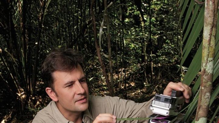 Professor Paul Moorcroft measures photosynthesis in an understory palm.