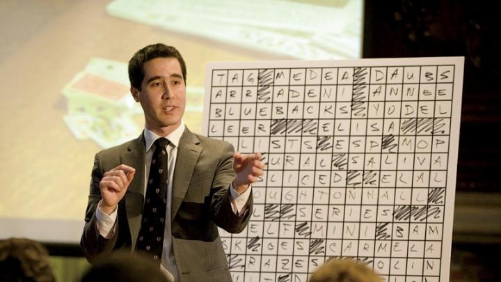 With audience input, Kwong constructs a crossword puzzle containing a hidden message.