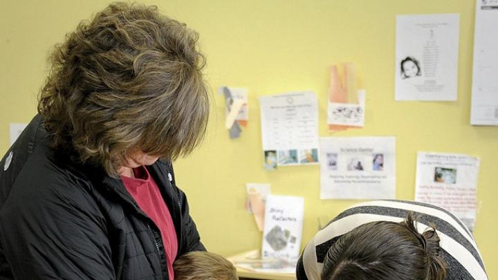 In Dorchester, Liam Denver has a hard time saying goodbye to his mother, Kim, as teacher Carolyn Christopher offers comfort.