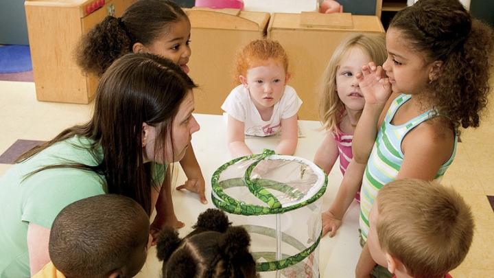 In Dorchester, at the Boys &amp; Girls Club, kindergarten-age children play with teacher Melissa Ryan.