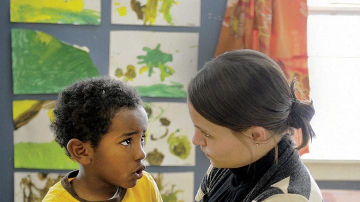 Teacher Carolyn Christopher comforts Joshua Medicke after his mother leaves.