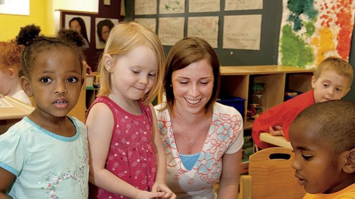 Teacher Meghan McDonough plays with preschoolers.