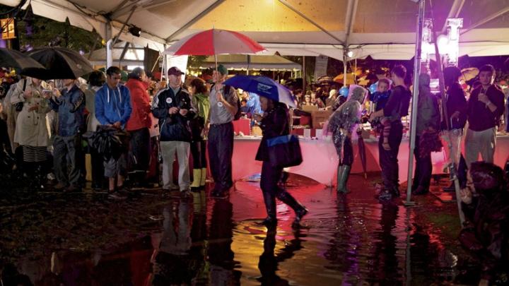 Harvard Yard had more standing water than solid ground, and partygoers gathered under the food tents to stay dry during downpours.