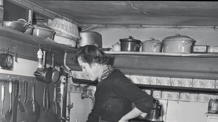 Child in her postwar Paris kitchen
