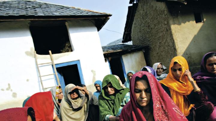 Vyasa Devi, foreground, mourning at the wake for her daughter, Meera, who died&mdash;by murder or suicide&mdash;in a marriage filled with physical abuse and demands for more dowry payments. Himachal Pradesh, December 2006.