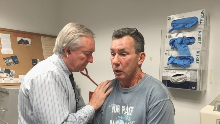 Jim O’Connell checks longtime patient Joe Meuse.