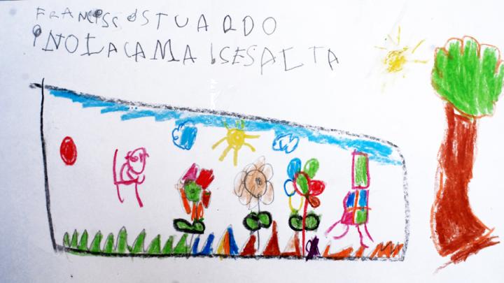 A close-up of a child's drawing depicting a scene from a book the child had read with a parent or teacher. These drawings, displayed outside a classroom at a UBC school, show the type of engagement with books the program tries to cultivate in students.