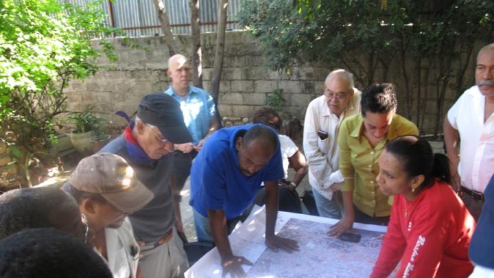 This image, provided by a member of the Boston University delegation upon his return from Haiti, shows the wall map sheets printed at Harvard being used for damage assessment surveys.