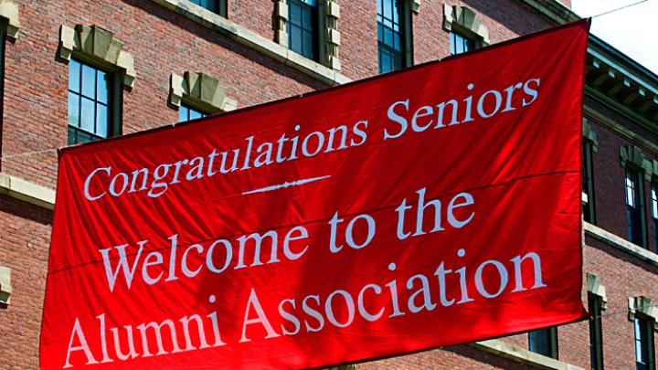Photograph by Jim Harrison May 25, 2010 - Outside Memorial Church, a banner welcomes seniors assembled for the Baccalaureate service into the company of alumni.