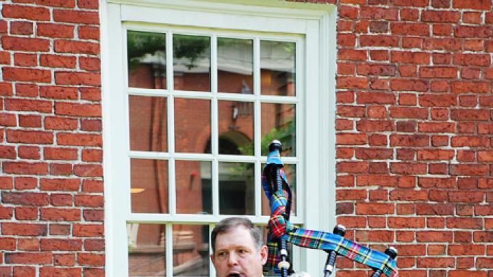 Photograph by Harvard Magazine/VL May 27, 2010 - Bagpiper Ian Massie of Wrentham, Massachusetts, led one contingent of the alumni procession on Thursday afternoon. He wears the Macbeth tartan.