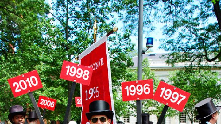 Photograph by Harvard Magazine/VL May 27, 2010 - Harvard Alumni Association staff member Brad Quigley had class-year signs to spare. His regular job title is assistant director for Harvard clubs and Shared Interest Groups.
