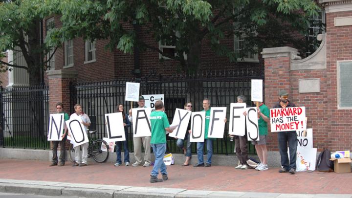Union members from AFSCME protest potential layoffs at Harvard on Commencement day.