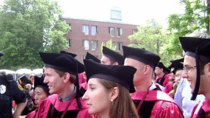 Unidentified professional school grads march bravely into the future