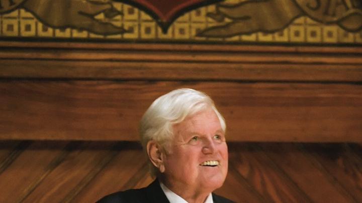 Senator Kennedy acknowledges his audience in Sanders Theatre last December, when he received an honorary degree.