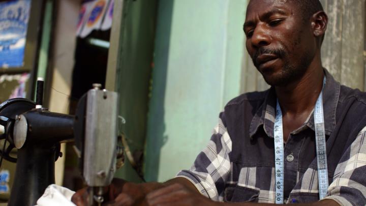 Matia Lule works as a tailor in Mbarara. SHIP provided the loan for him to buy his sewing machine; this business helps Lule afford transportation to the clinic to get his medicines, and other living expenses.