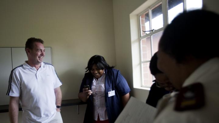 WhizzKids founder Marcus McGilvray chats with Edendale Hospital CEO Zalele Sindwandwe in the new WhizzKids Health Academy building. Opened in June, the building will offer HIV counseling and testing; support for antiretroviral therapy; a computer lab; and a soccer field.