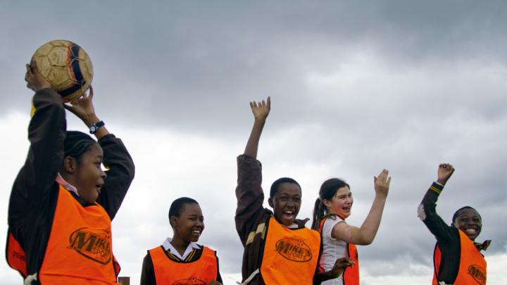 After the relay race, the winning team celebrates.