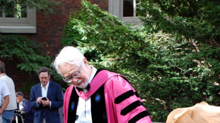 Cox asserts his endowed chair’s prerogative as Faith grazes in Tercentenary Theatre, once part of the College cow yard.