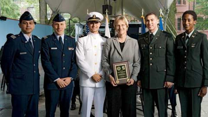 At the ROTC ceremony, from left to right: U.S. Air Force second lieutenants Roberto A. Guerra and Michael J. Arth, U.S. Navy ensign John D. Reed, President Faust, and U.S. Army second lieutenants Jason M. Scherer and J. Danielle Williams.