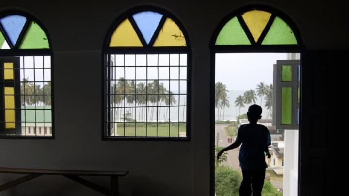 A child runs through the Anglican Church in Cape Coast, Ghana