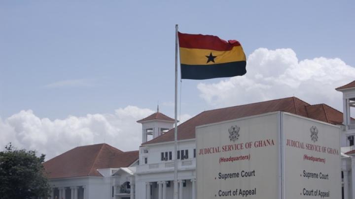 The Ghanaian flag flies above the Judicial Services headquarters in Accra