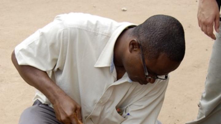 Launching an impromptu archaeological dig, Yaw Bredwa-Mensah, an archaeologist who co-teaches the Harvard Summer School course, extracts what turns out to be a German mineral-water bottle from a 17th-century street in Accra.