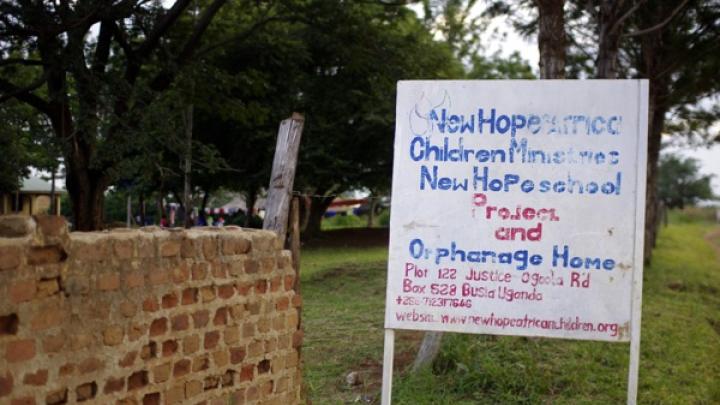 A sign on the road identifies the orphanage.