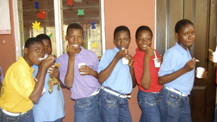 The girls take a break from activities for a snack. For some, this was the first time they ever tasted ice cream.