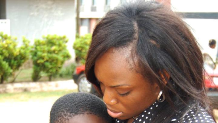 The end of the camp week was emotional for the girls, and for Johnson (shown here with camp participant Adewale Oluwadunni). The intensity of the experience makes it all the more important that Project Unveil have a continuing presence in the girls' lives, through the term-time after-school program and through camps held in future summers, says Johnson. 