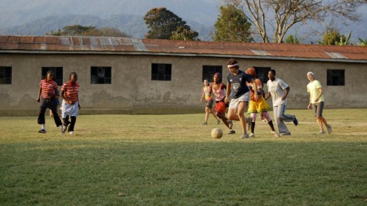 As part of the 2008 program studying conservation, Shutzer and other American students lived in Bangata, a town in northern Tanzania, for three weeks. Here, Shutzer takes the ball in a “USA v. Tanzania” soccer match that pitted the American students against girls from Bangata.