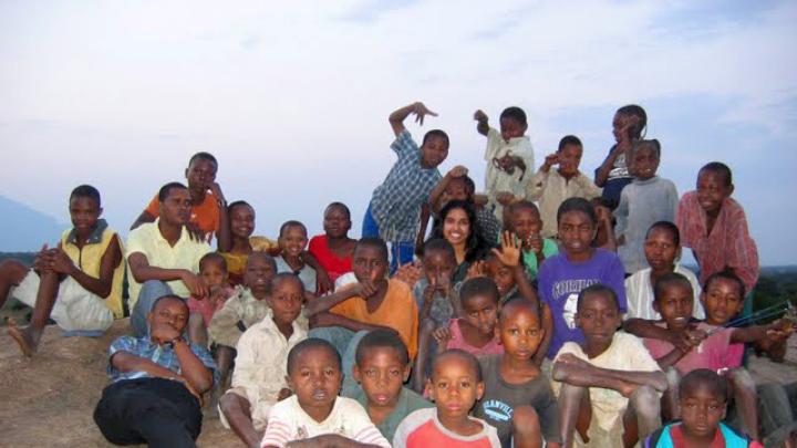 The SIC model relies on volunteers’ willingness to integrate themselves into the villages where they live (and seeks volunteers who will do so). In the late afternoon, Jasrasaria says, “the schoolchildren would climb up to the top of this <em>mwamba</em> (large rock) and we’d look out over the village and sing songs together.”